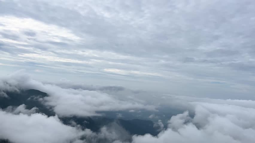 The mountains are covered by clouds.