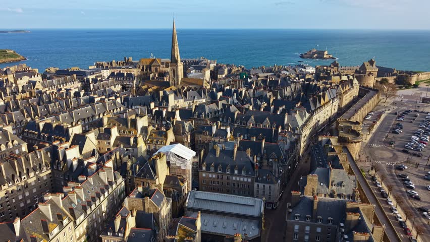 Drone flying over Saint-Malo Intra-Muros with birds and Fort National in background, Brittany in France