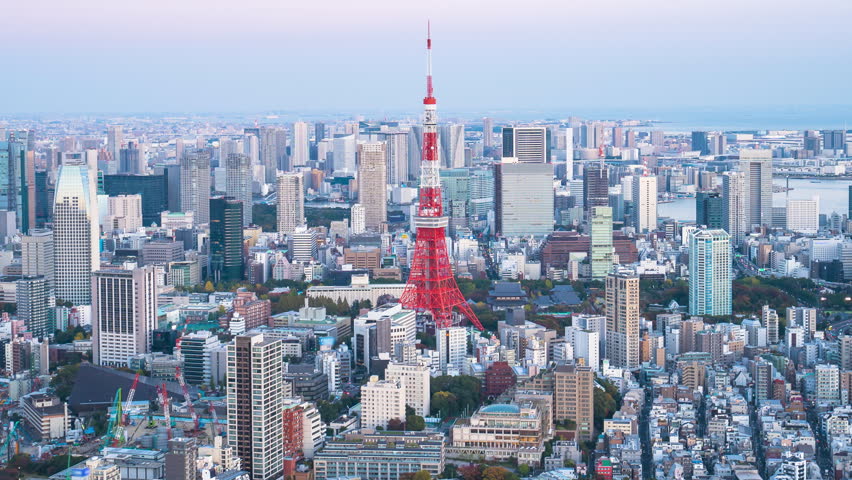 4k Time lapse Day to night of Tokyo tower with buildings in Tokyo City, Japan.