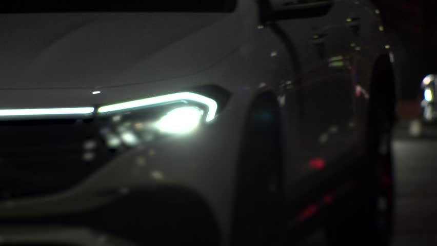 TOKYO, JAPAN : View of street traffic at night. Many cars passing on busy road in the downtown area. Transportation, urban traffic and night road concept slow motion shot.