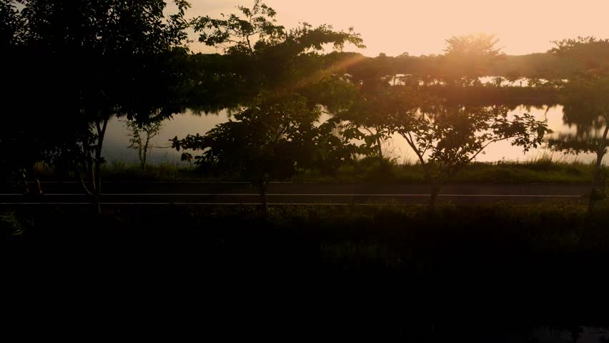 Sunset Light over Grass Field