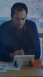 Vertical video: Man tapping tablet and causing holo globe cycling through regions for tech insight. Office, focus, data, visualization, interaction, gesture, vertical video - Powered by Shutterstock - Get 15% off with code: PIKWIZARD15