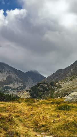 Vertical Timelapse of Storm Clouds Forming Over Alps Mountains in Summer