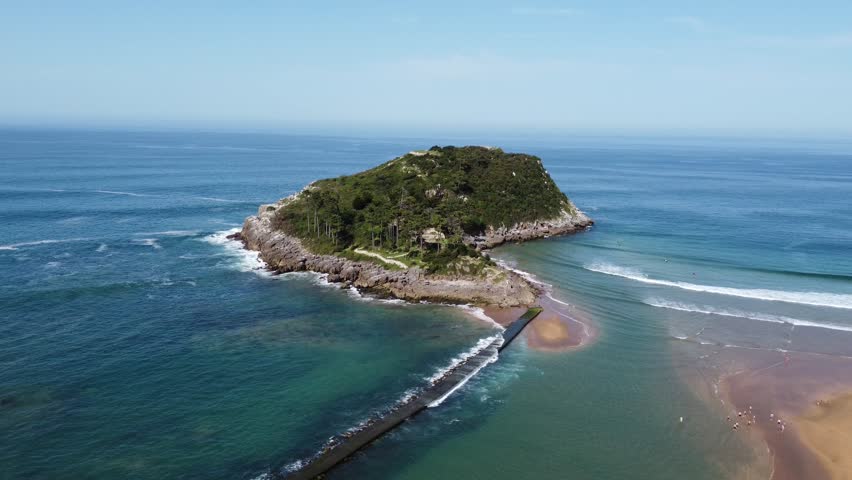 Aerial view of San Nicolas Island and sandbar tombolo in Lekeitio, Spain