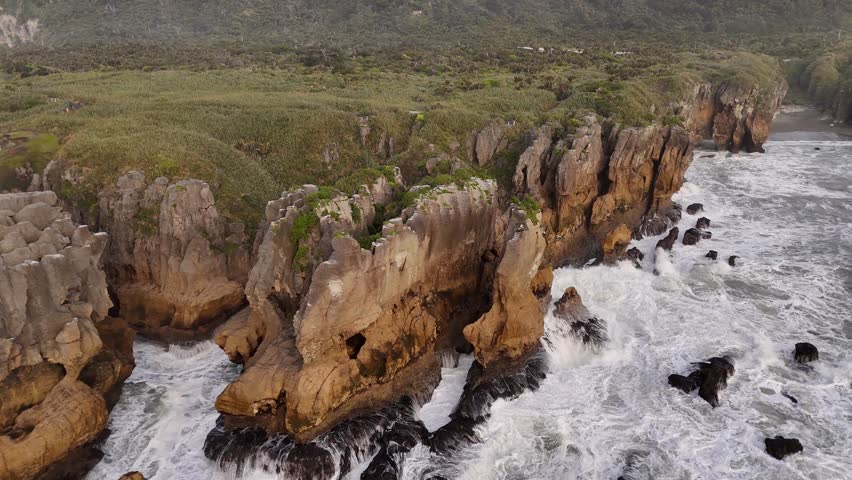 Aerial view of Pancake Rocks at sunset Punakaiki New Zealand, drone shot low angle closeup