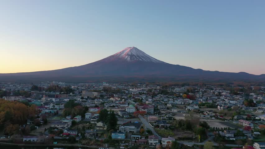 Aerial view 4k video by drone of Mount Fuji at Kawaguchi lake, Japan on sunset.	
