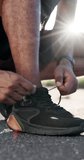 Fitness, shoes and tying laces with hands of man outdoor for runner, getting ready and health. Wellness, training start and athlete with sneakers of person in road for sports, workout and exercise - Powered by Shutterstock - Get 15% off with code: PIKWIZARD15