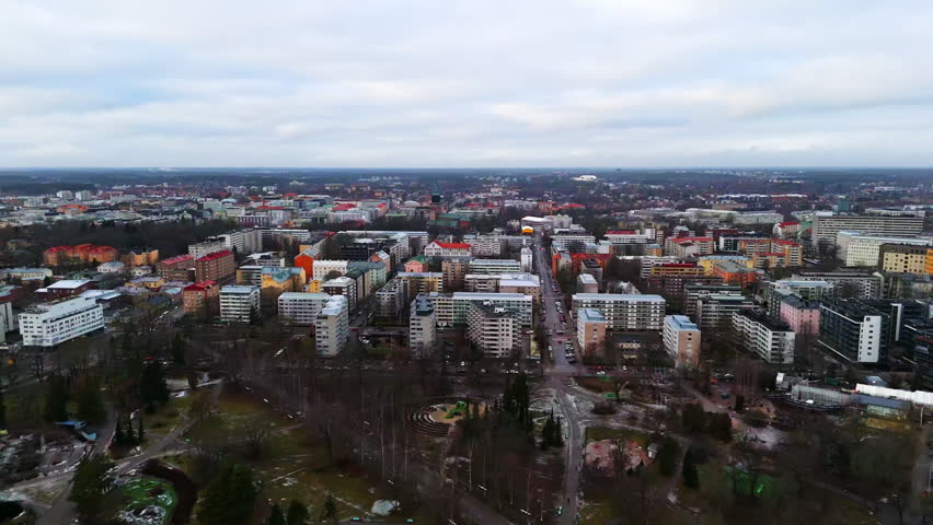 Aerial tracking shot in front of condos, Turku cathedral and downtown in Finland