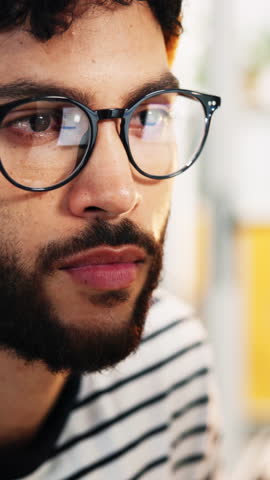 Glasses, creative and man in office, reading and research for news report, submission and deadline. Person, copywriting and journalist in workplace, reflection and eyewear for clear vision and ideas
