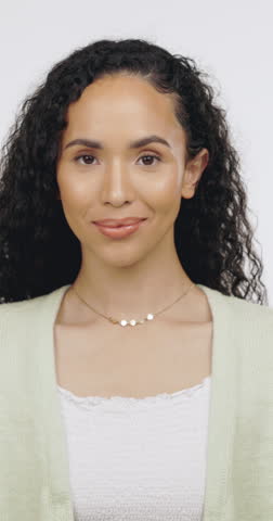 Face, vote and woman with thumb up in studio, agreement or positive opinion for university education. White background, promotion and person with acceptance sign, laughing and yes gesture for college