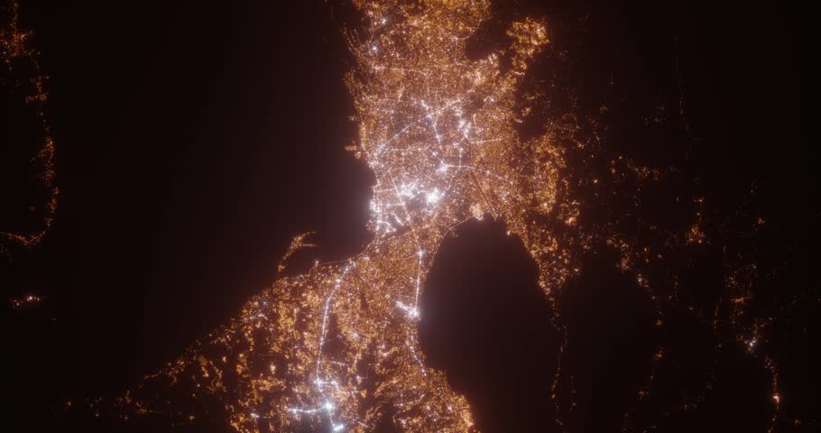Manila (Philippines) aerial view at night. Top view on modern city with street lights. Camera is zooming out, rotating clockwise