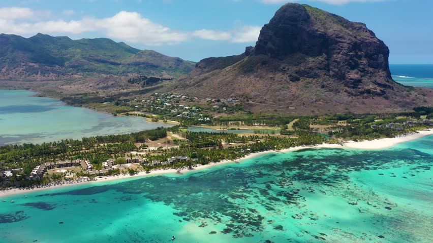 Tropical scenery, beautiful beaches of Mauritius island, Le Morne, popular luxury resort. Le Morne beach luxury resorts, Mauritius. Luxury beach in Mauritius, sandy beach with palms and blue ocean.