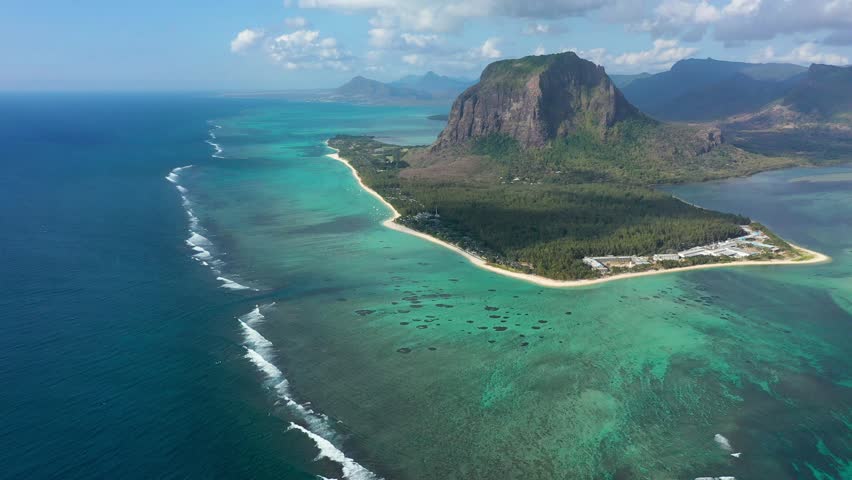 Aerial view of Mauritius island panorama and famous Le Morne Brabant mountain, beautiful blue lagoon and underwater waterfall. Le Morne Brabant peninsula and Underwater Waterfall, Mauritius.