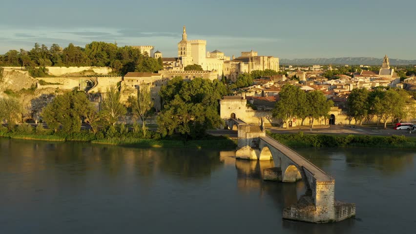Beautiful view of Avignon with famous bridge Saint-Benezet, medieval architecture along the Rhone River in Avignon, France. The Pont Saint Benezet and the Papal palace in Avignon, South France.