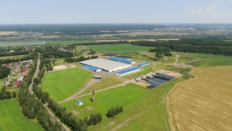Drone Flying Backward High above Rural Farmland