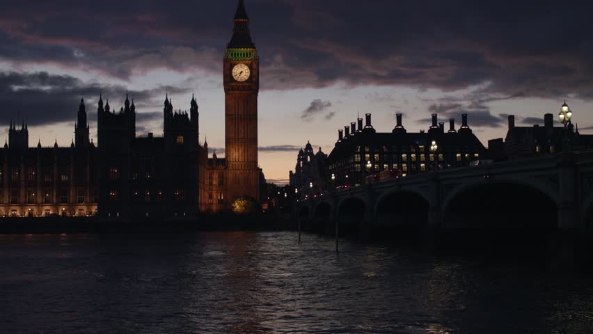 This 4K video shows the Elizabeth Tower at the Palace of Westminster. The visual documents the 315-foot tall masonry structure, the four clock faces, and the internal housing for the Big Ben bell. The composition illustrates the Gothic Revival design on the banks of the River Thames, documenting urban landmarks and historical engineering for editorial media.