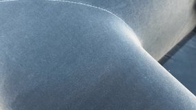 Ultra close-up shot of soft blue velvet cushion fabric texture, showing plush fibers and subtle light reflections.  - Powered by Shutterstock - Get 15% off with code: PIKWIZARD15