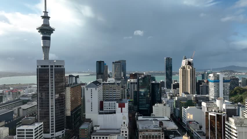 Auckland , New Zealand. Skyline. New Skyscrapers. Dolly Flight through Urban Canyon in Sunset or Sunrise Light. Aerial Pedestal in Establishing Drone Shot. 