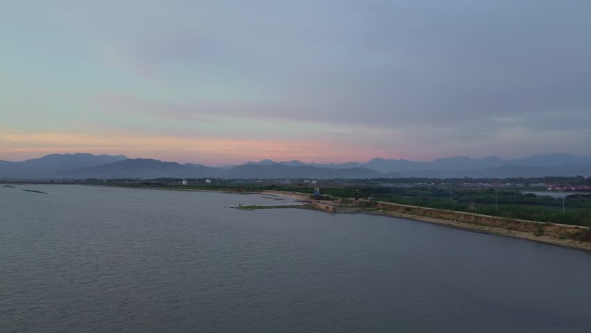 Coastal Landscape at Dusk with Mountains