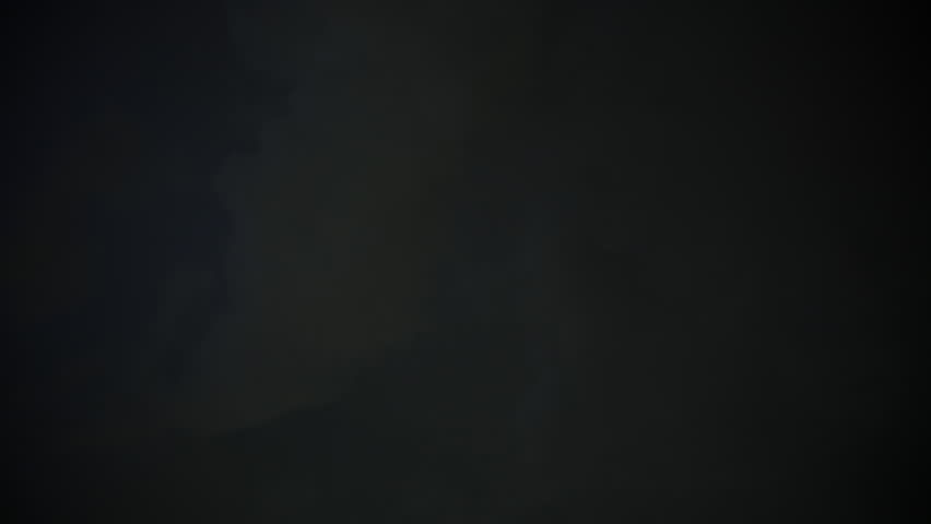 Dark storm clouds with endless lightning in night sky. Dramatic thunderstorm, heavy weather, atmospheric background.