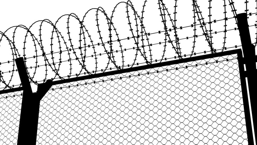 barbed wire of the correctional facility on the background of a gloomy cloudy sky. Crime, crackdown, illegal concept Prison, jail view. Lattice.