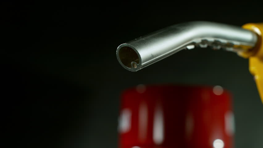 Close-up of Gasoline Spurting from the Gas Pump Nozzle , Slow Motion , Filmed on High Speed Cinematic Camera at 1000 FPS