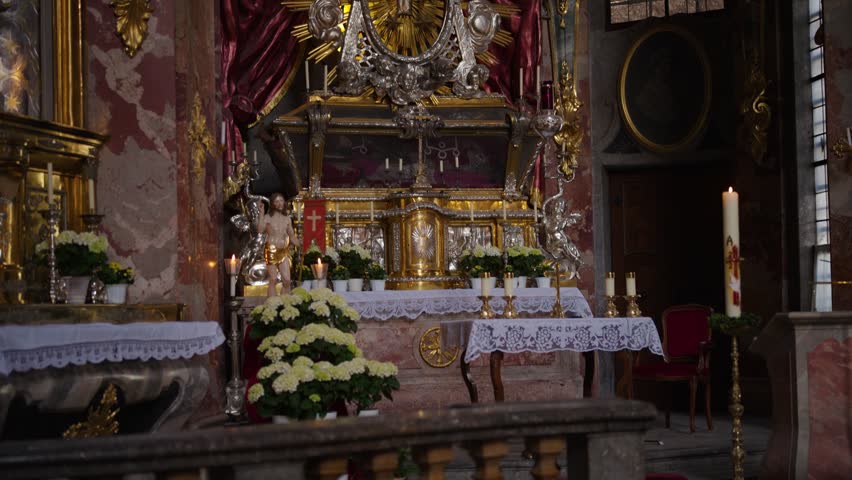 Interior of the Asam Church in Munich with golden altar and ornate Rococo decorations, St. Nepomuk