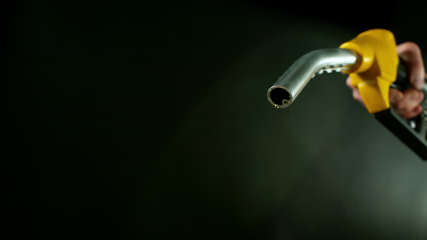 Close-up of Gasoline Spurting from the Gas Pump Nozzle , Slow Motion , Filmed on High Speed Cinematic Camera at 1000 FPS
