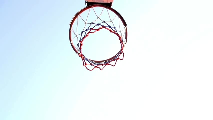 basketball hoop with a basket on outdoor playground for street leisure game. Basketball court outdoors, net and backboard for basket ball game outside.