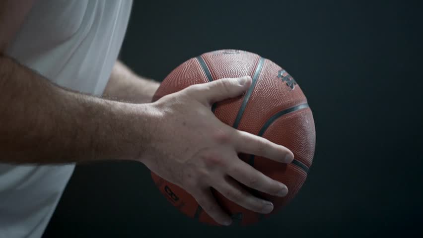 Front view of active fit basketball player training on sport court. players legs during the basketball practice. man training in dribbling basketball.