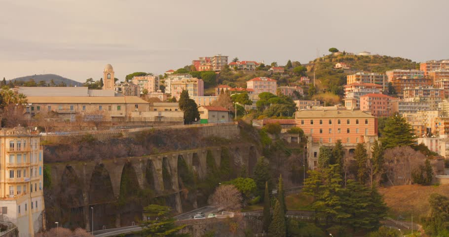 Savona offers a high-angle perspective highlighting buildings, greenery, and urban structure. This view captures the essence of a vibrant Italian city.