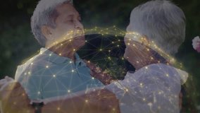 Senior man clasping hands starting dancing with senior woman in garden, tech sphere outlining bond. Couple, outdoor, park, greenery, flowers, pink, embrace - Powered by Shutterstock - Get 15% off with code: PIKWIZARD15
