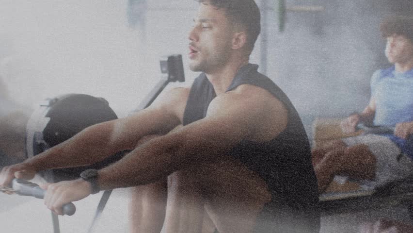 Three men gripping erg handles and initiating stroke, driving legs and pulling for fitness training. Rowers, cadence, gym, teamwork, cardio, intensity, equipment