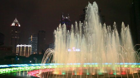 Fountain glows lights in night  Stock Video