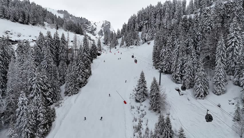 Avoriaz portes du soleil ski track at Les Lindarets, Ardent with the skiers and cabin lift in the French Alps, savoy, France