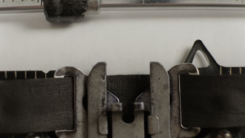 Verdict being typed on vintage typewriter on sheet of paper close-up