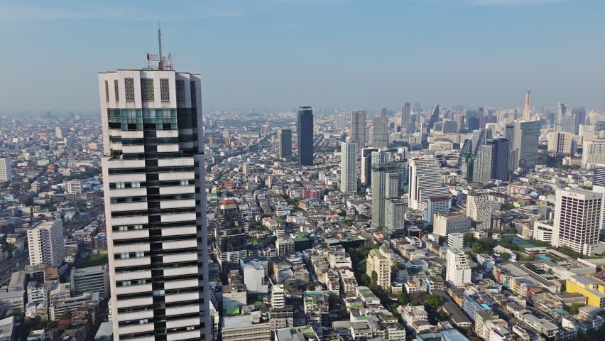 Aerial high view of Bangkok city, urban skyscrapers and office buildings in business district, Thailand, panorama 4k