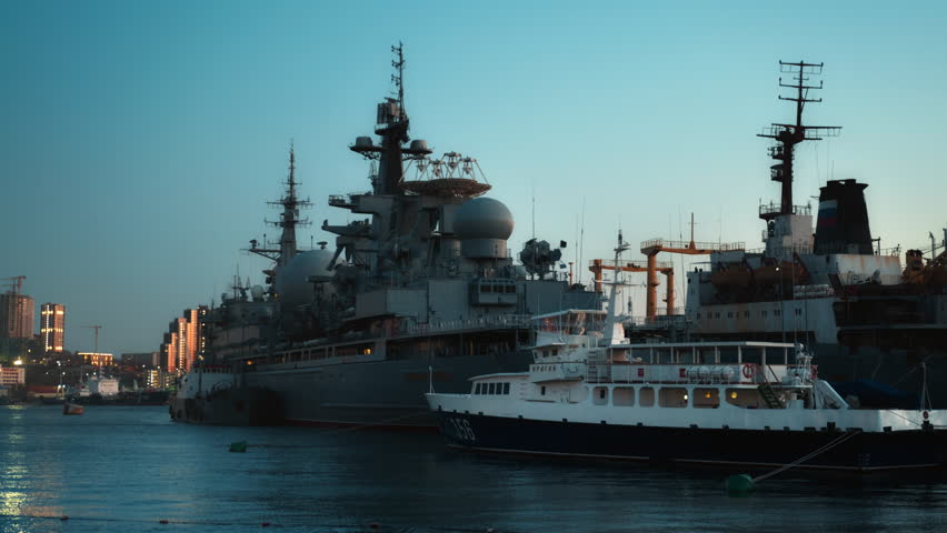 Tracking ship Marshal Krylov of the russian navy anchored in a bay, featuring antennas, radar, and communication equipment in Vladivostok city.