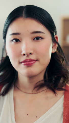 Face, Asian woman and arms crossed in home with confidence, weekend break and positive attitude. House, wellness and person relax with living room, portrait and self care or chilling in lounge
