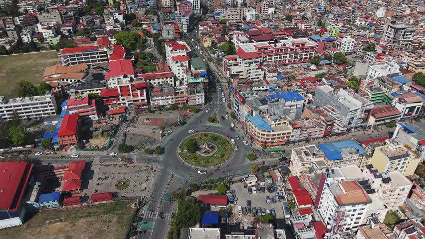Aerial view of Kathmandu Valley, showing dense urban landscape, residential areas, and surrounding hills in Nepal’s capital region.