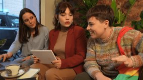 Creative Team Collaborating Together using tablet - business meeting in a cozy coffee - Powered by Shutterstock - Get 15% off with code: PIKWIZARD15