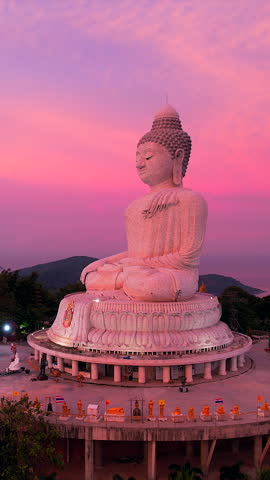 The Big Buddha on the mountaintop, combined with the view of the sunrise in the morning, is a very beautiful view in Phuket province, southern Thailand.