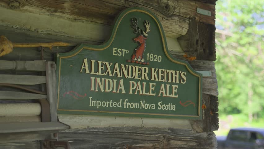 A close-up shot of a classic green and gold Alexander Keith
