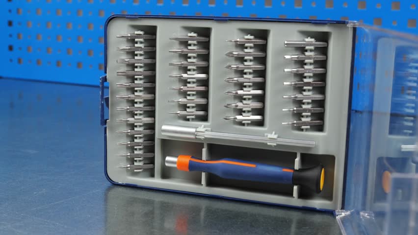 A set of tools with bits in a plastic case.