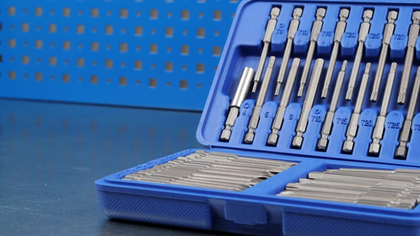 A set of tools with bits in a plastic case.