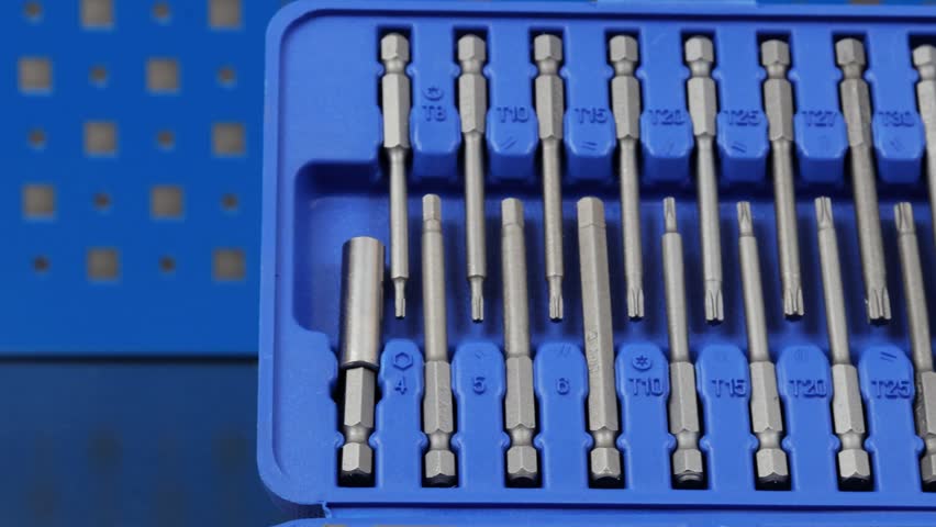 A set of tools with bits in a plastic case.
