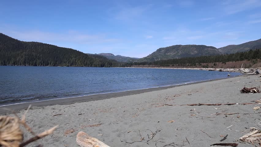 Calm Coastal Beach with Mountains and Forest, Vancouver Island Canada