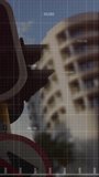 Vertical video: Pole getting data, HUD showing numbers as red trend dipping then rising for transit. Urban, street, traffic, highrise, architecture, balconies, vertical video - Powered by Shutterstock - Get 15% off with code: PIKWIZARD15