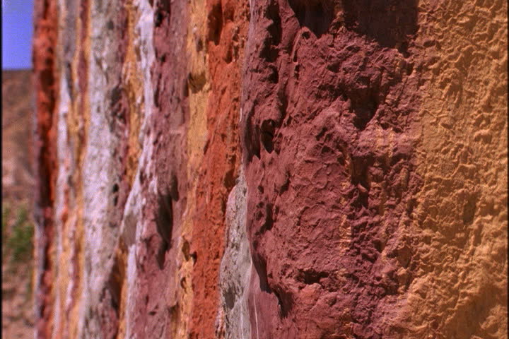 Pan over bright painted stripes on chorten in Mustang, Nepal.