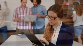 Woman tapping tablet in team workspace, revealing business charts while reviewing data. Collaboration, colleagues, office, devices, analytics, brainstorming, whiteboard - Powered by Shutterstock - Get 15% off with code: PIKWIZARD15